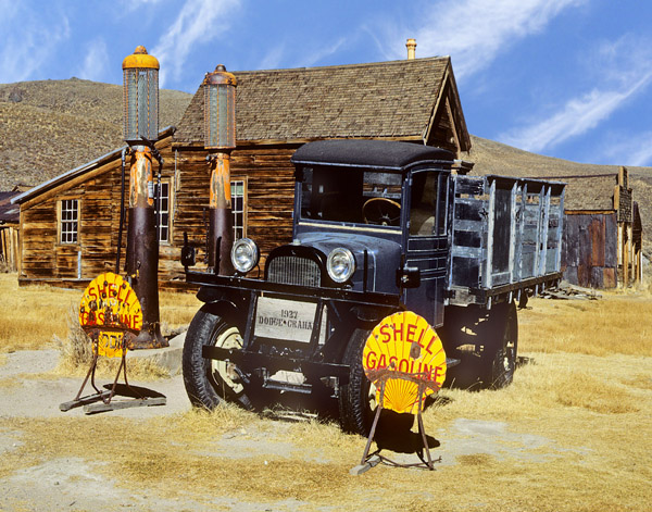 Old truck outside deserted gas station in Bodie