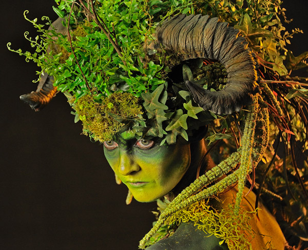 Stylized head of a woman with horn and leaf headdress