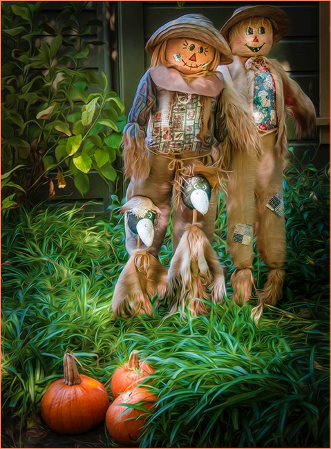 Two Scarecrows and Pumpkins