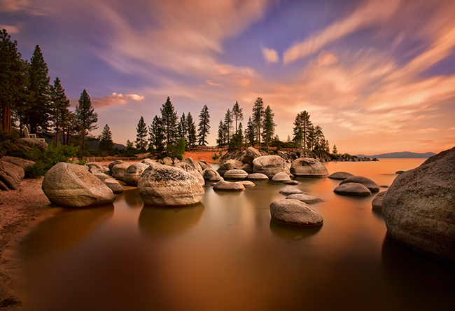 Sunset on rocky beach